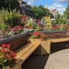 Parklet bench surrounded by flowers